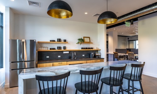 Open concept kitchen with breakfast bar and island