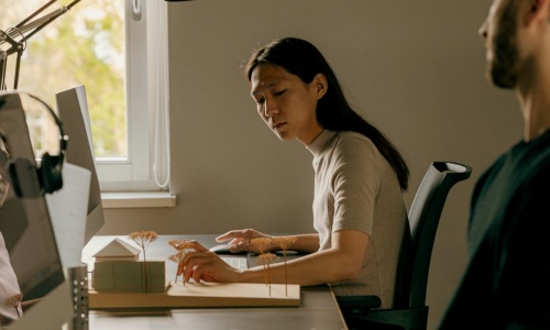 a woman sitting on a desk