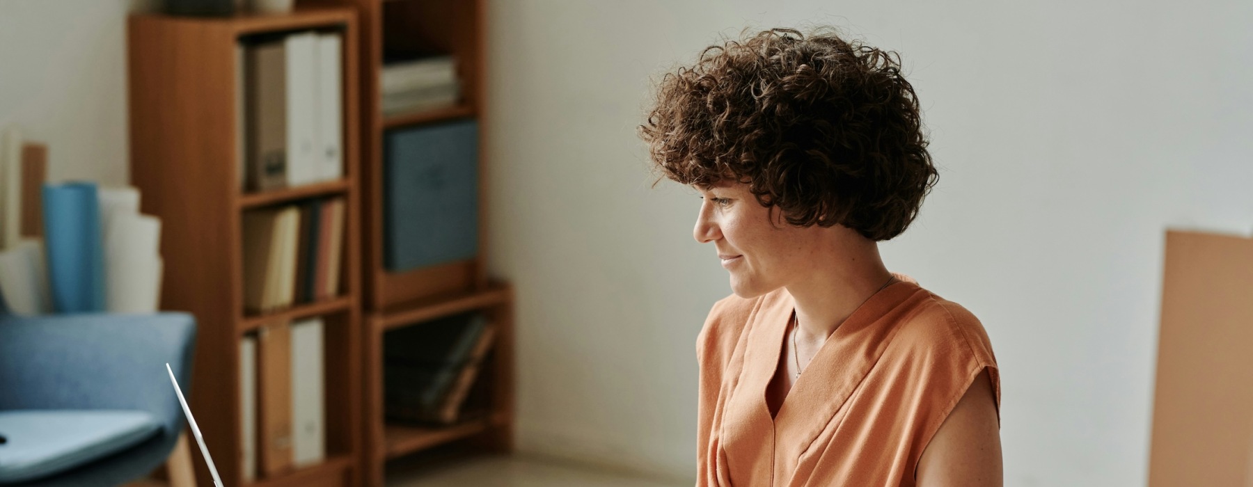 a woman sitting in a work environment